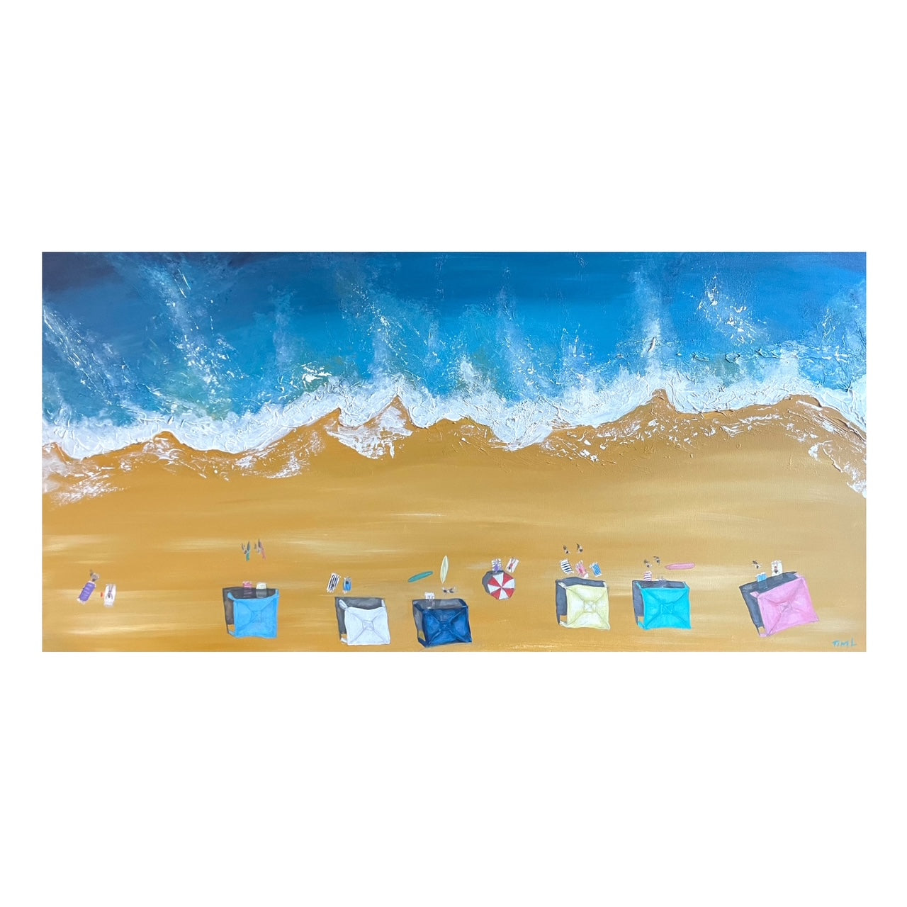 Beach scene with colorful beach bags and towels on sand and surf.
